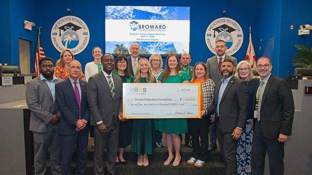 Broward County Public Schools Superintendent Howard Hepburn, center left next to check, Broward County School Board members and school administrators, along with members of the Broward Education Foundation and Bridge2Life, accept a $1.1 million grant from the Helios Education Foundation. Broward County Public Schools Superintendent Howard Hepburn, center left next to check, Broward County School Board members and school administrators, along with members of the Broward Education Foundation and Bridge2Life, accept a $1.1 million grant from the Helios Education Foundation.